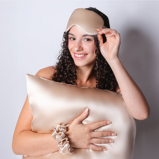 Model Holding Organic Champagne Silk Pillowcase For Curly Hair