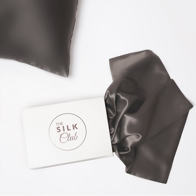 The Silk Club Charcoal Grey Silk Pillow Close-up and Gift Box