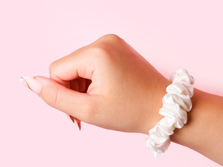 Model Wearing Small White Silk Scrunchie On Wrist