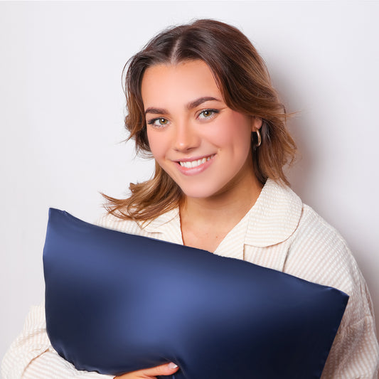 Model Holding Organic Navy Blue Silk Pillowcase For Skin and Hair