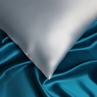 Blue Silk Pillowcase On Silk Backdrop