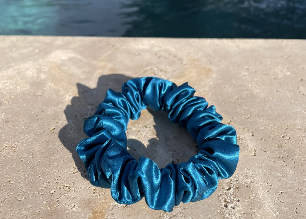 Azure Blue Silk Scrunchie next to swimming pool