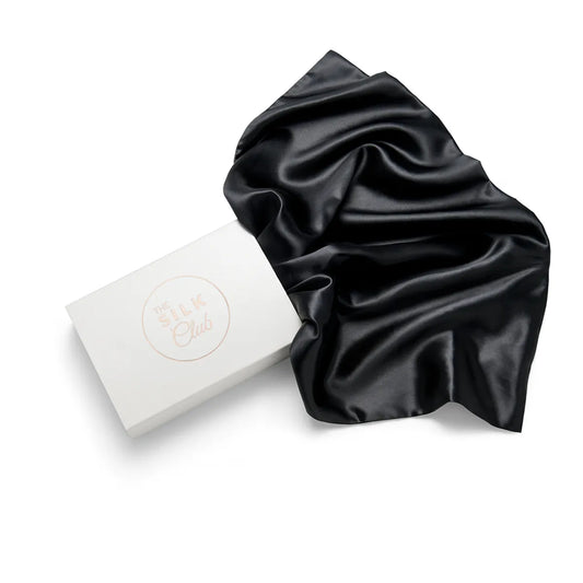 Black Silk Pillow and Gift Box Close-Up