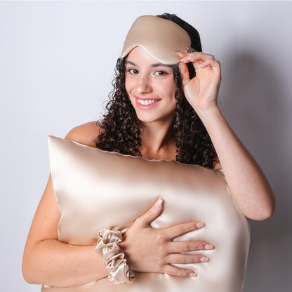 Model Holding Organic Champagne Silk Pillowcase For Curly Hair