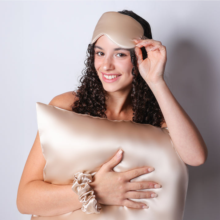 Model Holding Organic Champagne Silk Pillowcase For Curly Hair