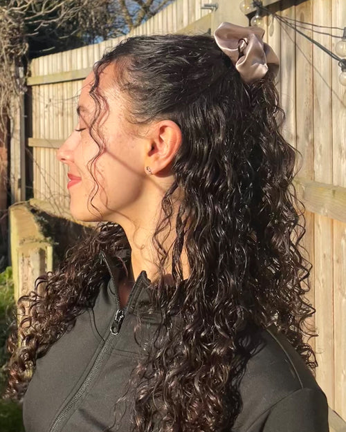 Half-up, half-down Curly Haistyle with Big Rose Gold Silk Scrunchie - Curly Hairstyle Ideas