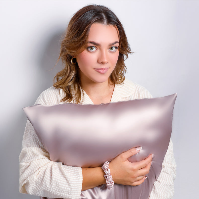 Model Holding Organic Lilac Silk Pillowcase For Skin and Hair