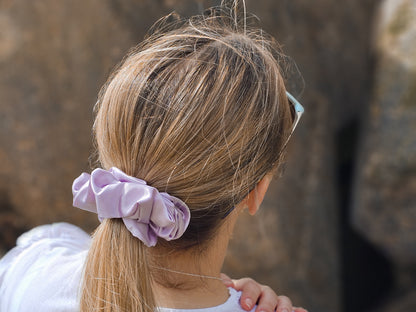Model wearing large lilac silk scrunchie - scrunchie hairstyle ideas