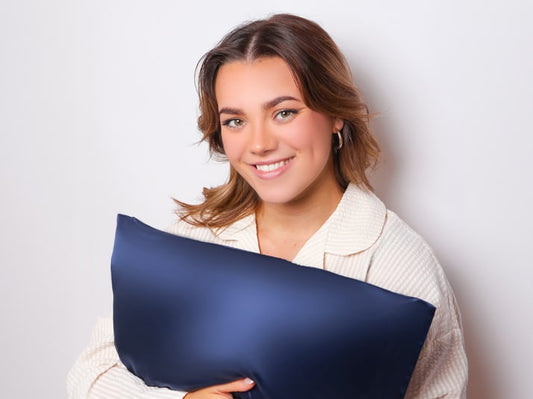 Model Holding Navy Blue Silk Pillowcase