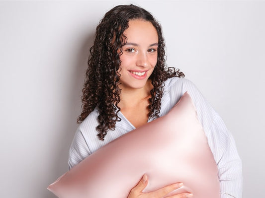 Model Holding Light Pink Mulberry Silk Pillowcase