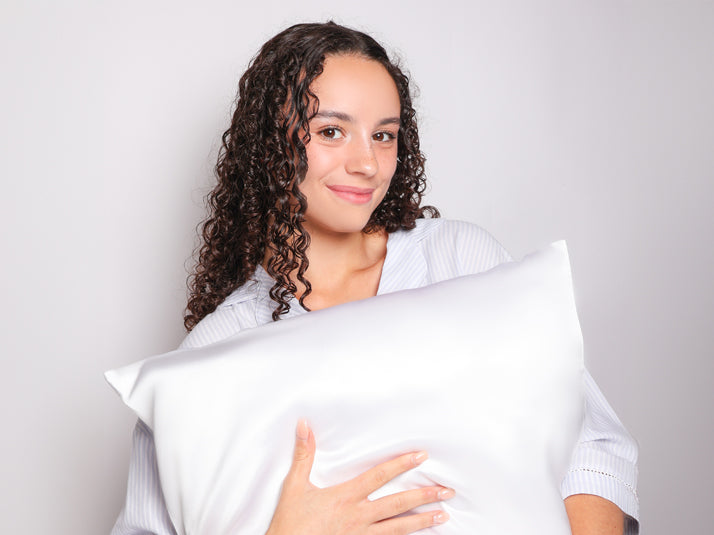 Model Holding White Mulberry Silk Pillowcase