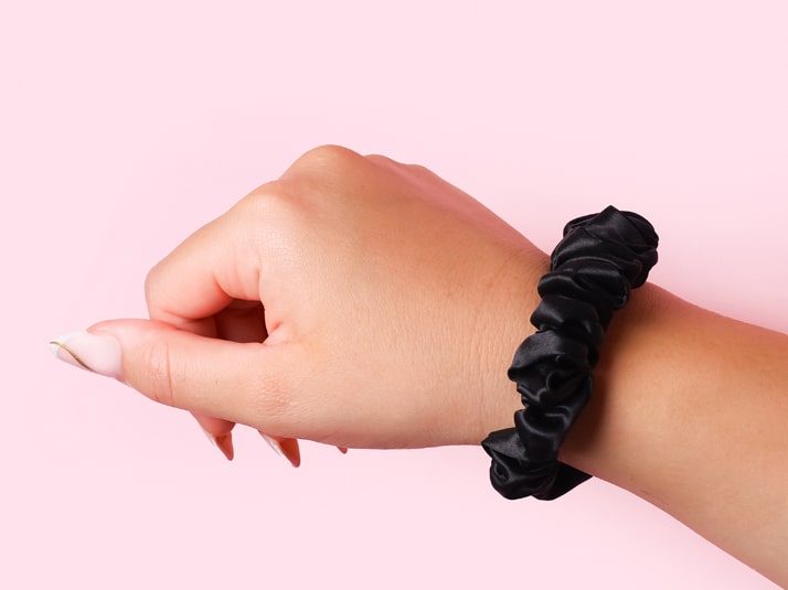 Model Wearing Black Small Silk Scrunchie On Wrist
