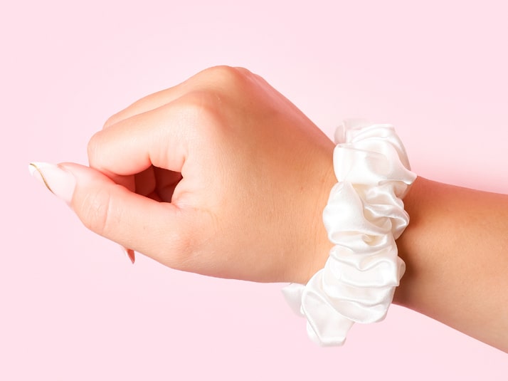 Model Wearing White Silk Scrunchie On Her Wrist