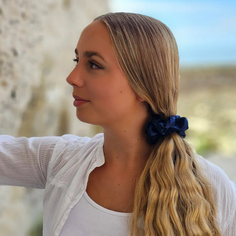 Hair Styled in a Side Ponytail with Navy Blue Scrunchie