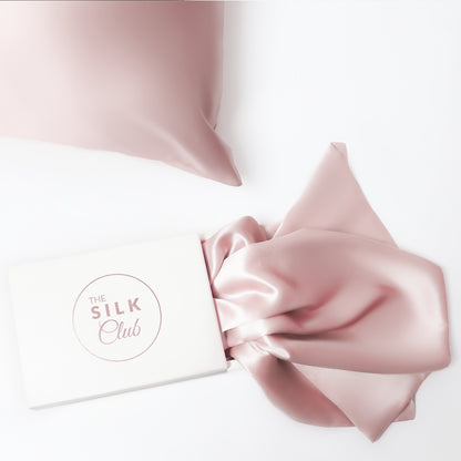 The Silk Club Pastel Pink Silk Pillow close-up and Gift Box