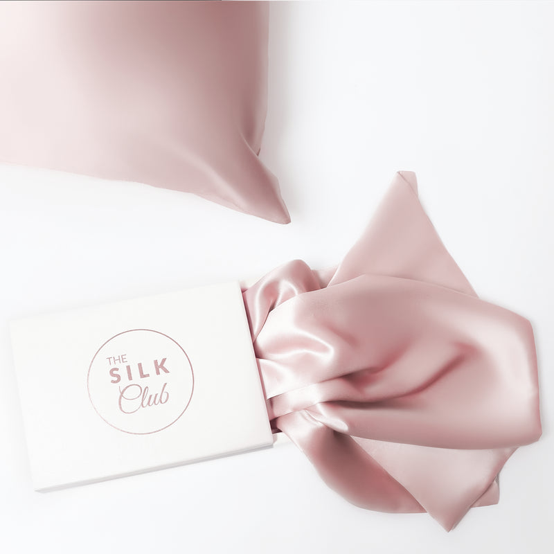The Silk Club Pastel Pink Silk Pillow close-up and Gift Box