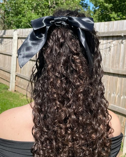 Curly Half-Up, Half-Down Hairstyle With Black Silk Hair Bow Scrunchie - Scrunchie Hairstyle Ideas