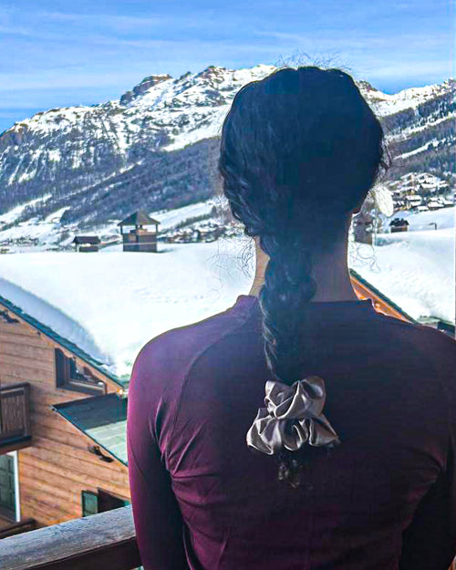 Long plait styled with large rose gold silk scrunchie - Scrunchie Hairstyle Ideas